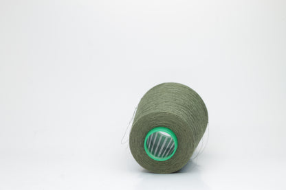 Fine, single-ply linen yarn in a rich Army. Reveals a crisp texture and subtle natural sheen, typical of pure linen fiber.