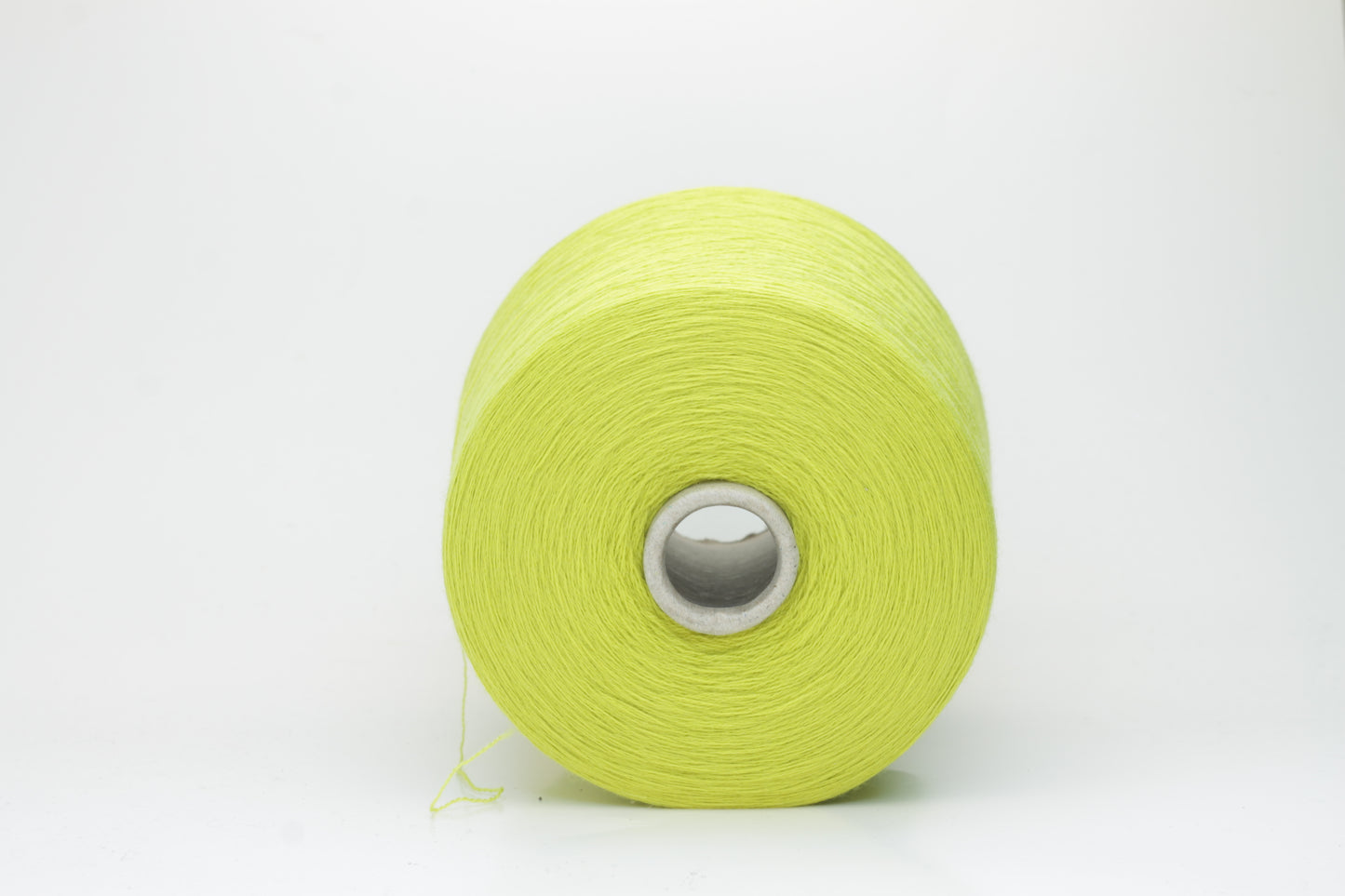 Close-up of luxurious Lime Merino wool yarn, two-ply twist with a soft, subtle sheen, and fine, consistent thread structure.
