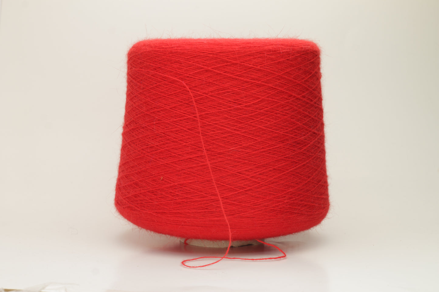 Angora 70%, 20% PA, 10% WV. Nm 1/15 Gold Extra. Color Red