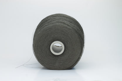 Skein of finely spun yarn, a muted artichoke green. Its smooth, even twist reveals the crisp texture of linen with a subtle, natural sheen. Low fluff, clean look.