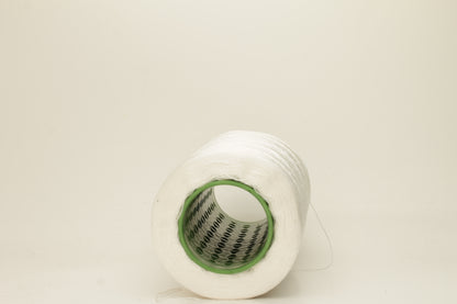 Close-up of pristine white, finely plied 100% silk yarn, twisted smoothly to reveal a high, lustrous sheen and uniform structure.