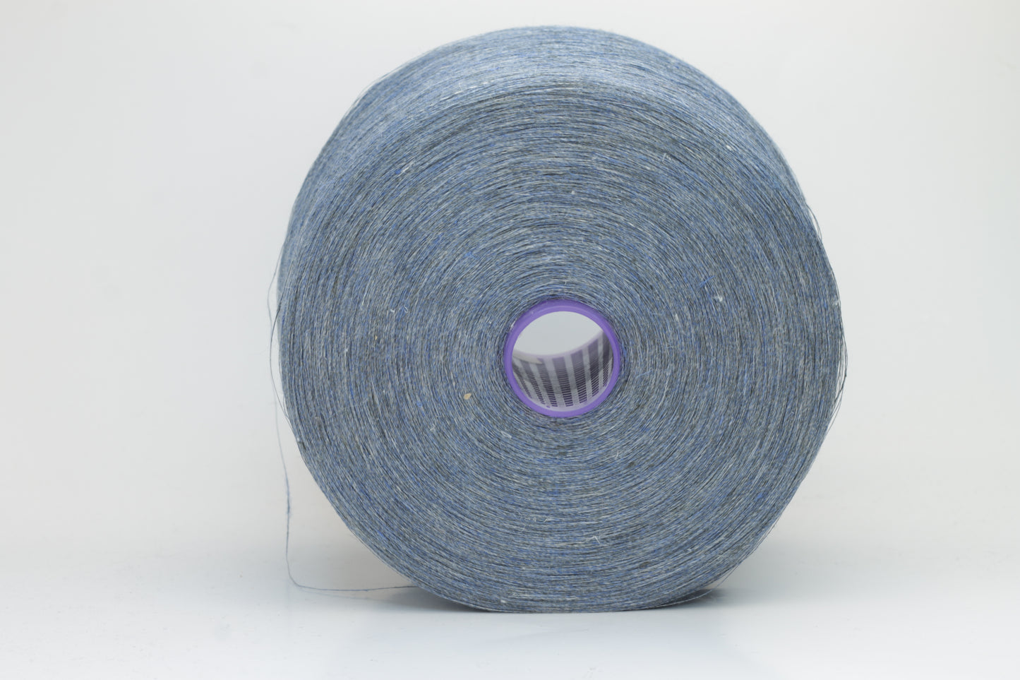 Fine, single-ply linen yarn in a rich Denim. Reveals a crisp texture and subtle natural sheen, typical of pure linen fiber.