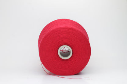 Close-up of luxurious Red Merino wool yarn, two-ply twist with a soft, subtle sheen, and fine, consistent thread structure.