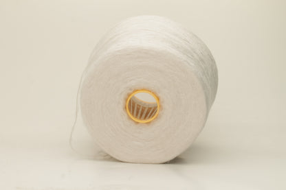 Luxurious, pristine white single-ply silk yarn with a smooth, uniform texture and a delicate sheen, softly coiled.