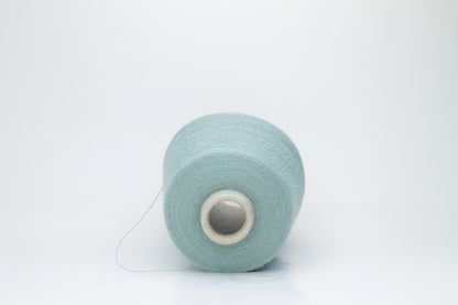 Dusty Mint 2-ply Alpaca Merino yarn, softly twisted with a gentle halo and subtle sheen, showcasing its deep, luxurious color saturation.