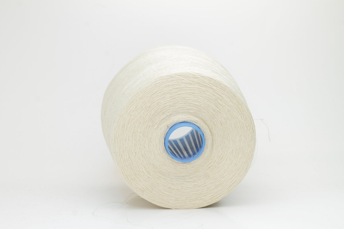 Fine, single-ply linen yarn in a rich Cera. Reveals a crisp texture and subtle natural sheen, typical of pure linen fiber.