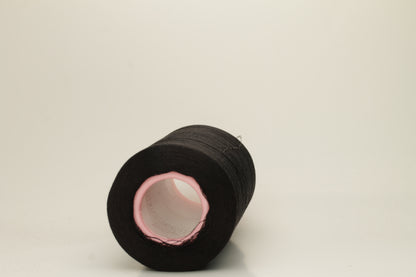 A skein of fine, single-ply 100% silk yarn, lustrous with a deep, rich Black hue, reflecting light softly.