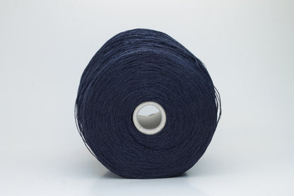 Close-up of pristine Navy linen and viscose blend yarn, softly twisted with a subtle sheen, showcasing its fine, smooth texture.