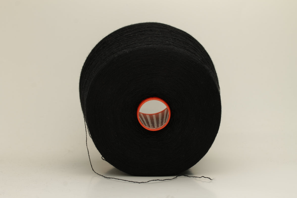 Rich, deep black 2-ply yarn with a fine, smooth twist; exhibits a subtle sheen and incredibly soft, uniform texture.
