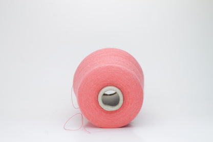 Coral 2-ply Alpaca Merino yarn, softly twisted with a gentle halo and subtle sheen, showcasing its deep, luxurious color saturation.
