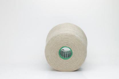 Fine, single-ply linen yarn in a rich Oatmeal. Reveals a crisp texture and subtle natural sheen, typical of pure linen fiber.