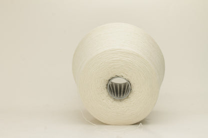 Close-up of a skein of pristine Ice White 100% cashmere yarn, showcasing its fine, evenly plied two-ply structure and delicate, soft halo.