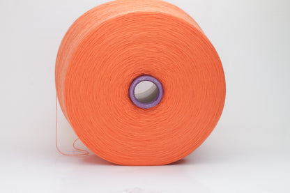 Close-up view of vibrant orange Merino 100% Cashwool yarn, showcasing a tight ply twist and a dense, fluffy texture with subtle sheen.