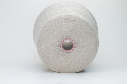 Close-up shot of a vibrant, creamy beige merino yarn skein, showcasing its subtle sheen, delicate ply twist, and the fine, soft texture of the fibers.