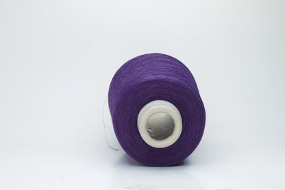 Rich, deep purple yarn wound into a soft, slightly textured skein, exhibiting a subtle natural sheen from its linen content and a smooth, even twist.