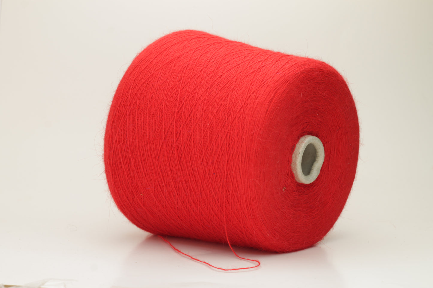 Angora 70%, 20% PA, 10% WV. Nm 1/15 Gold Extra. Color Red