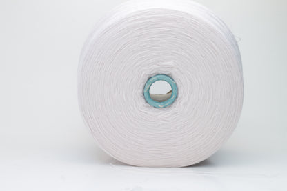 Close-up of soft, light pink Zegna Baruffa merino wool yarn with a fine ply twist, showcasing the dense thread structure and subtle sheen.