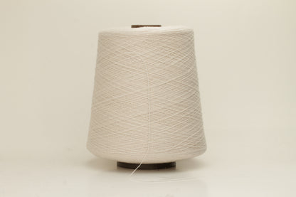 Rich, White 2-ply yarn with a fine, smooth twist; exhibits a subtle sheen and incredibly soft, uniform texture.
