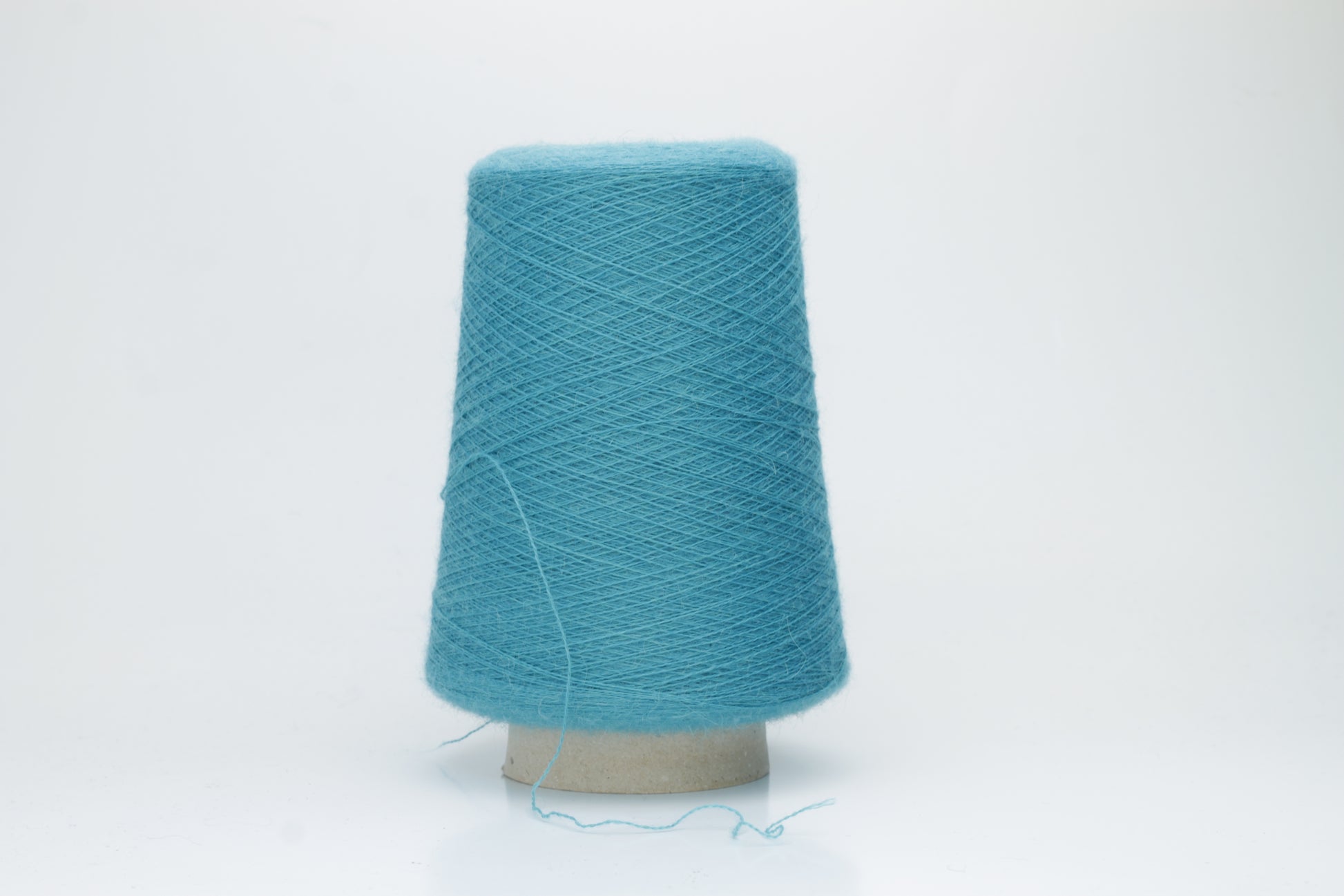 Rich Petrol 2-ply Alpaca Merino yarn, softly twisted with a gentle halo and subtle sheen, showcasing its deep, luxurious color saturation.