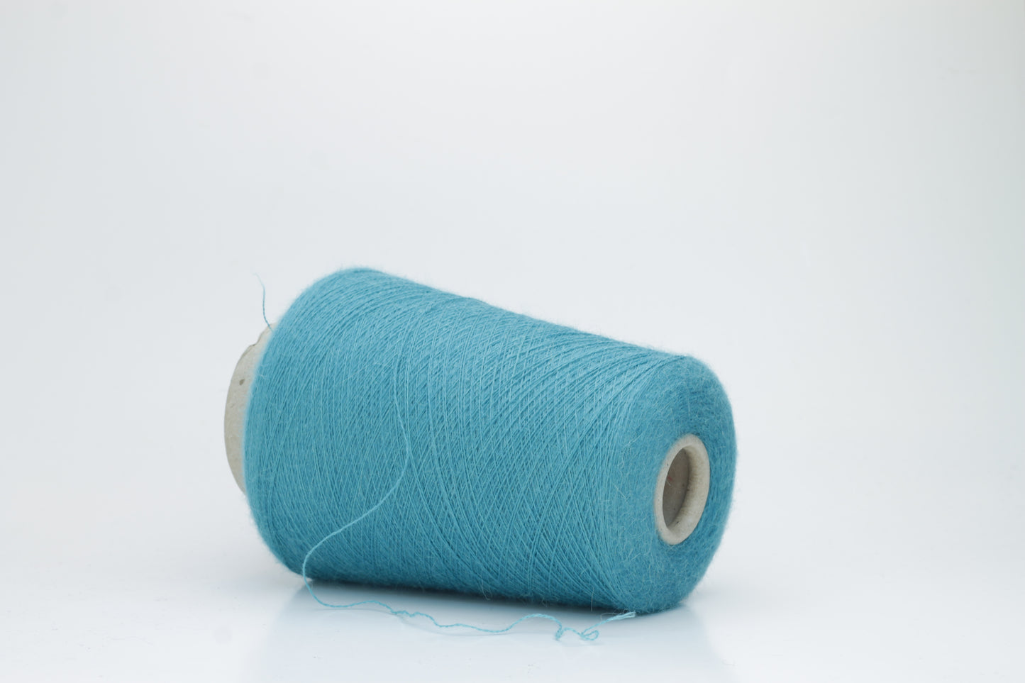 Rich Petrol 2-ply Alpaca Merino yarn, softly twisted with a gentle halo and subtle sheen, showcasing its deep, luxurious color saturation.