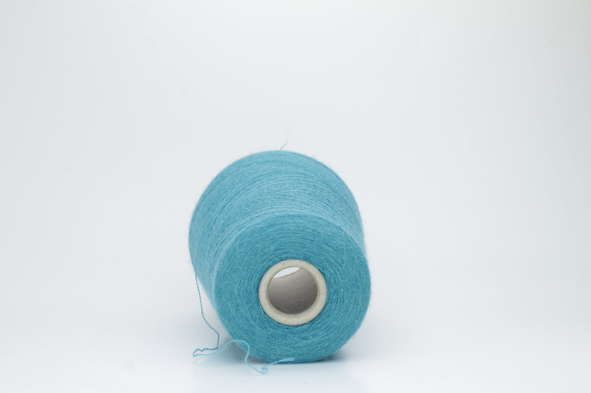Rich Petrol 2-ply Alpaca Merino yarn, softly twisted with a gentle halo and subtle sheen, showcasing its deep, luxurious color saturation.