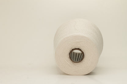 Rich, White 2-ply yarn with a fine, smooth twist; exhibits a subtle sheen and incredibly soft, uniform texture.