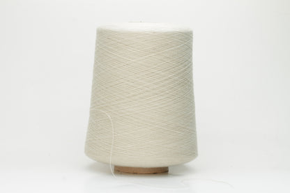 Close-up of a neatly wound cone of fine, smooth 4-ply cotton yarn in a soft off-white hue, showing a subtle matte sheen and even twist.